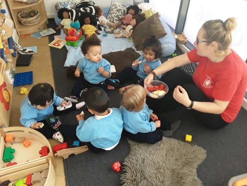 teacher and babies playing at a Montessori Pre-school and Nursery Serving Colindale, Edgware & St Albans UK