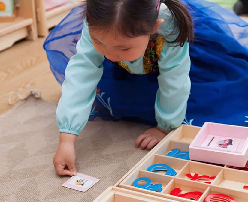 young toddler playing in class at a Montessori Pre-school and Nursery Serving Colindale, Edgware & St Albans UK